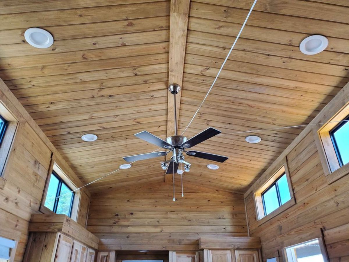Living area has an artifact ceiling fan installed which is also included in the deal