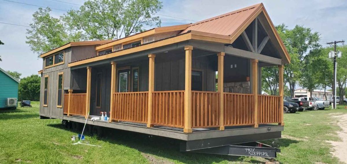 Wooden exterior with amazing space outside of 399 sf Park Model Tiny House