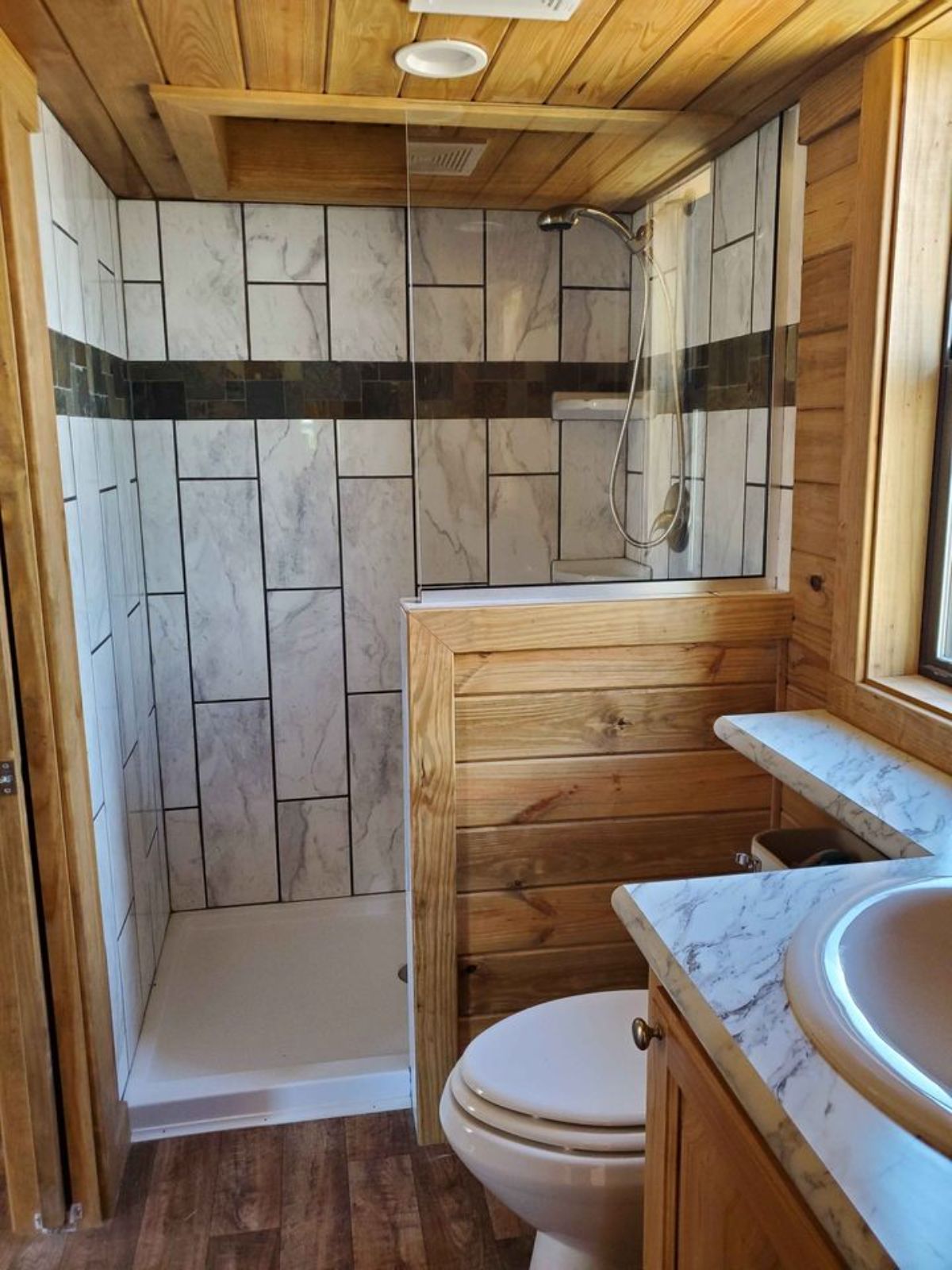 Separate shower area in bathroom of 399 sf Park Model Tiny House
