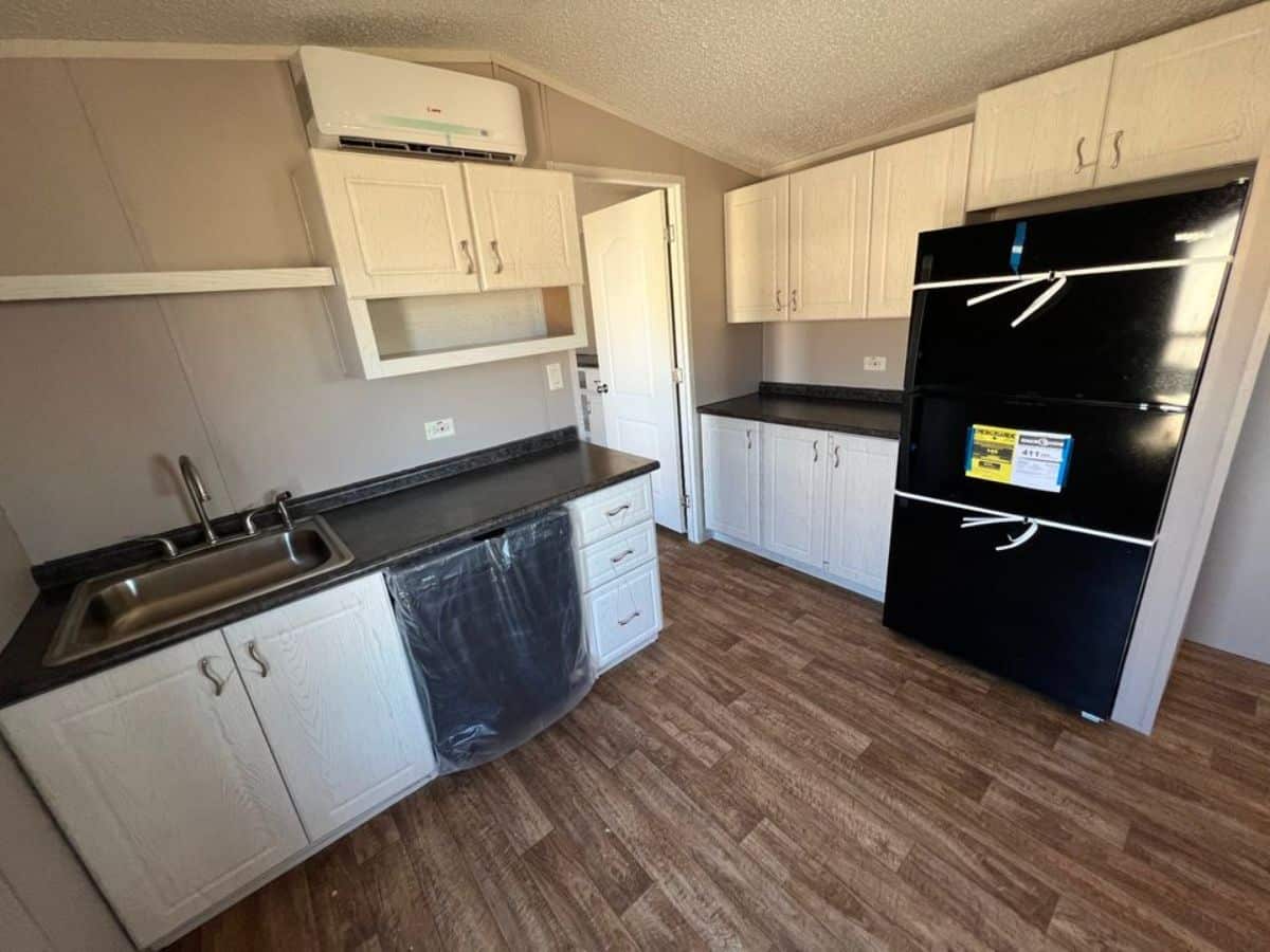Living and kitchen area of 399 sf Spacious Tiny House