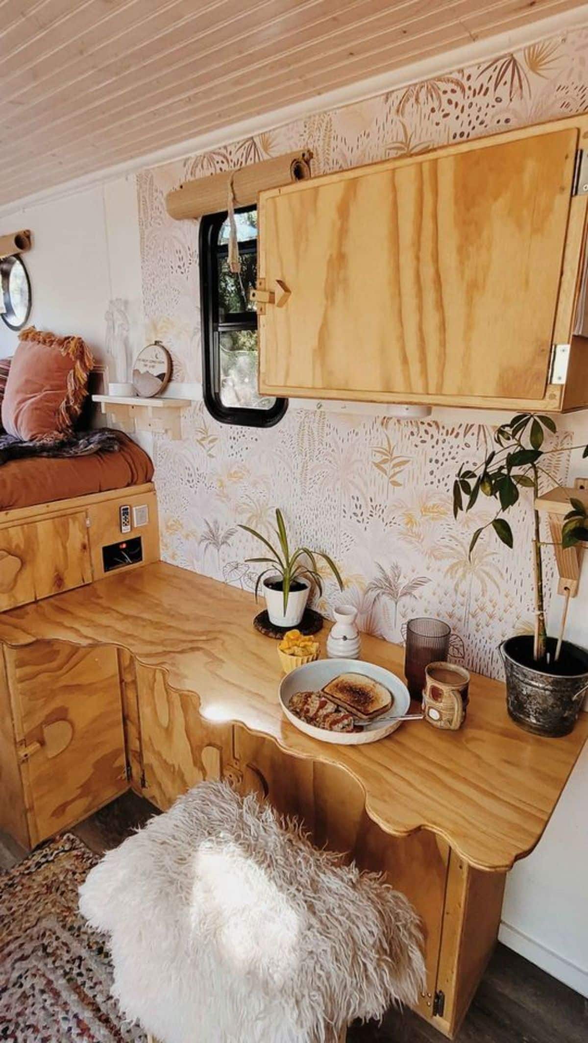 Custom wood work in interiors of 14’ Tiny Camper makes it more stylish