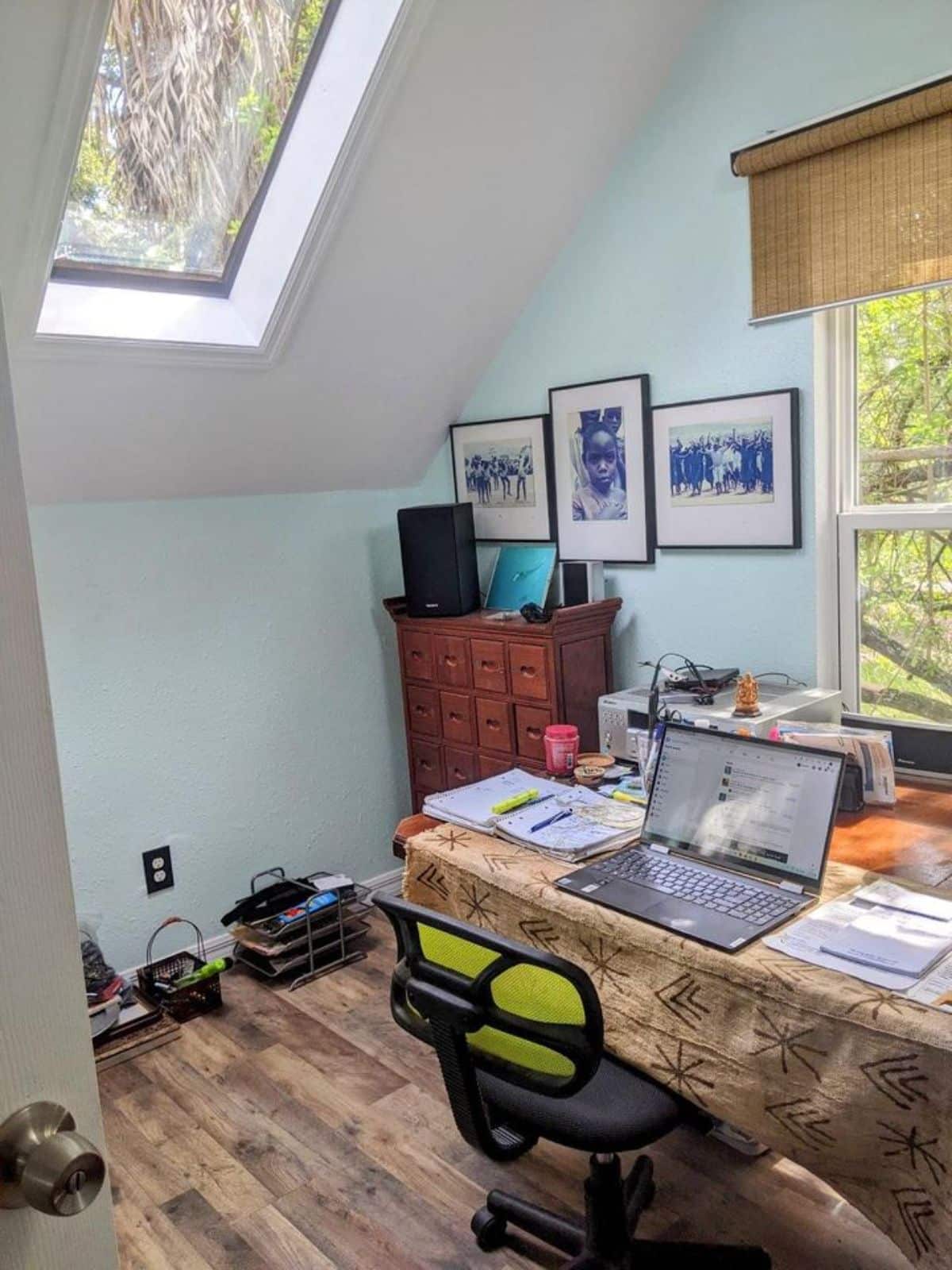 Living area of 2 Bedroom Tiny House with Land has a work setup desk