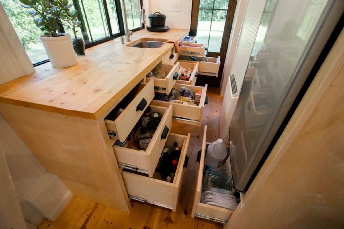 Close drawers under kitchen cabinets of 20’ Tiny House