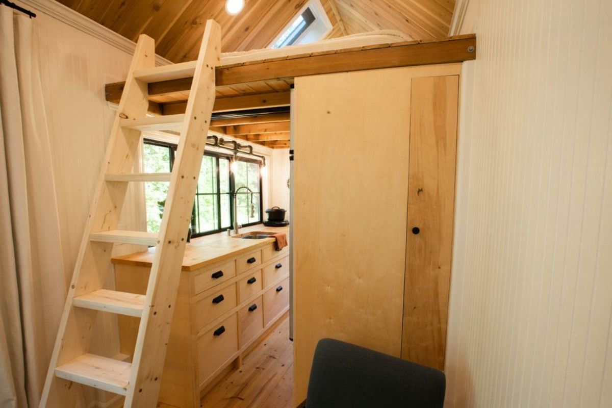 Ladder towards the loft bedroom of 20’ Tiny House