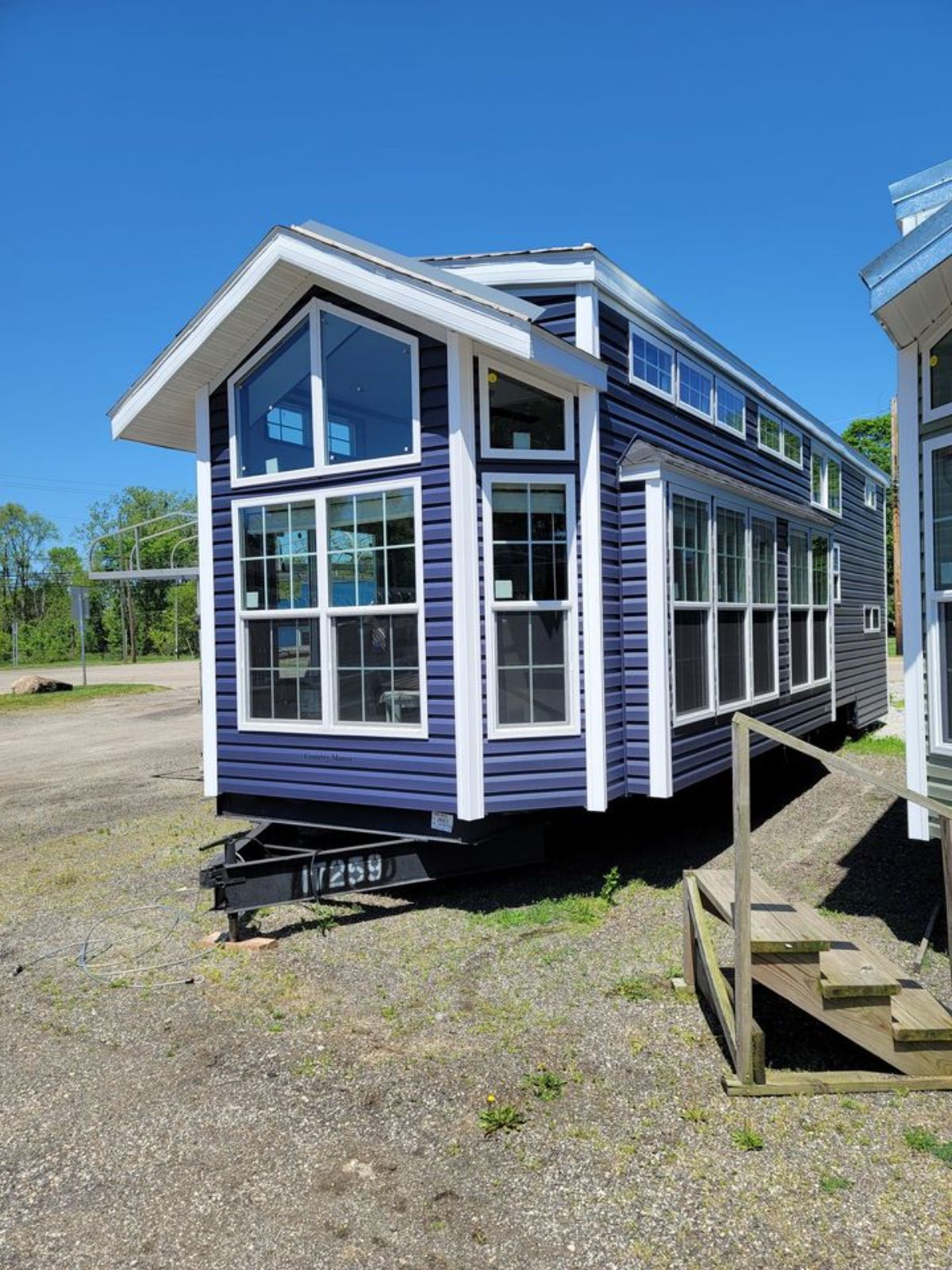Stunning blue exterior of 2022 Park Model Tiny Home from outside