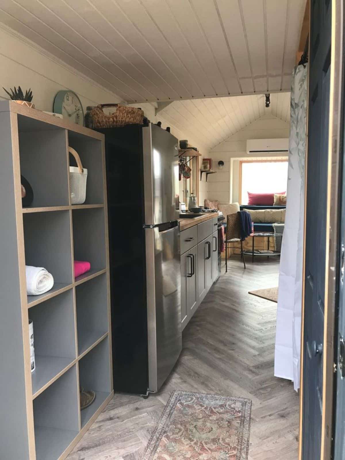 Wooden Interiors of 24’ Custom Built Tiny Home, it has refrigerator, storage cabinets etc