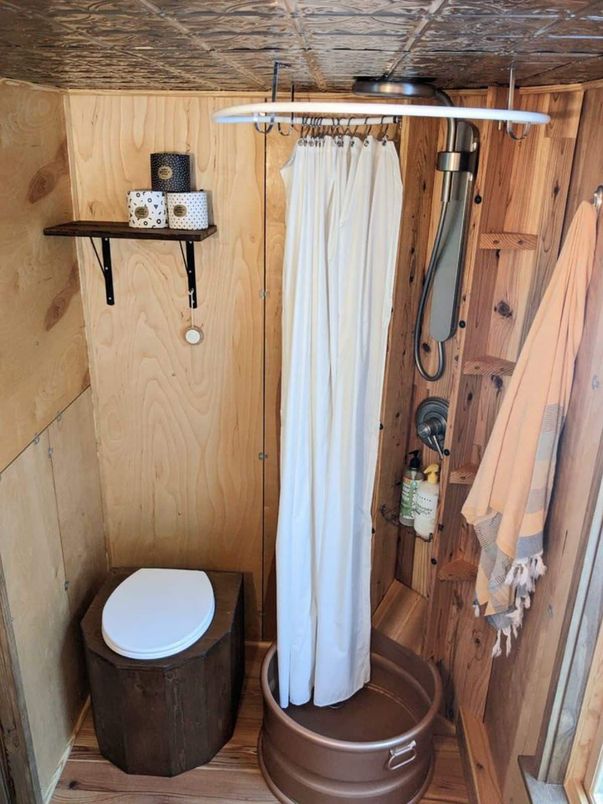 Standard toilet and shower area of 24’ One Bedroom Tiny House