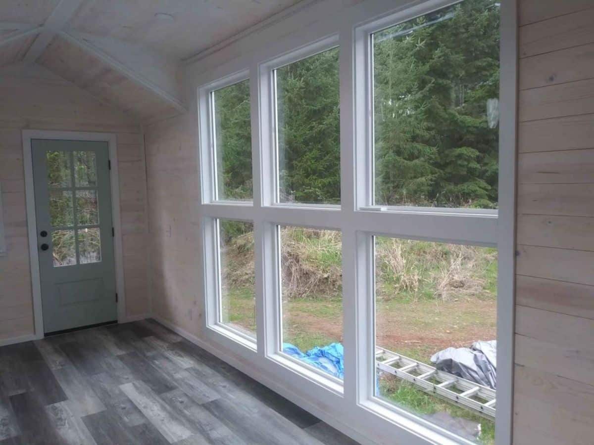 Huge window panes make 24’ Tiny House Can Be Your Studio or Workspace more brighter