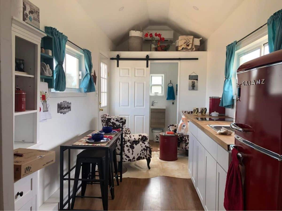 Stunning interior of 28’ Fully Furnished Tiny House from kitchen area view