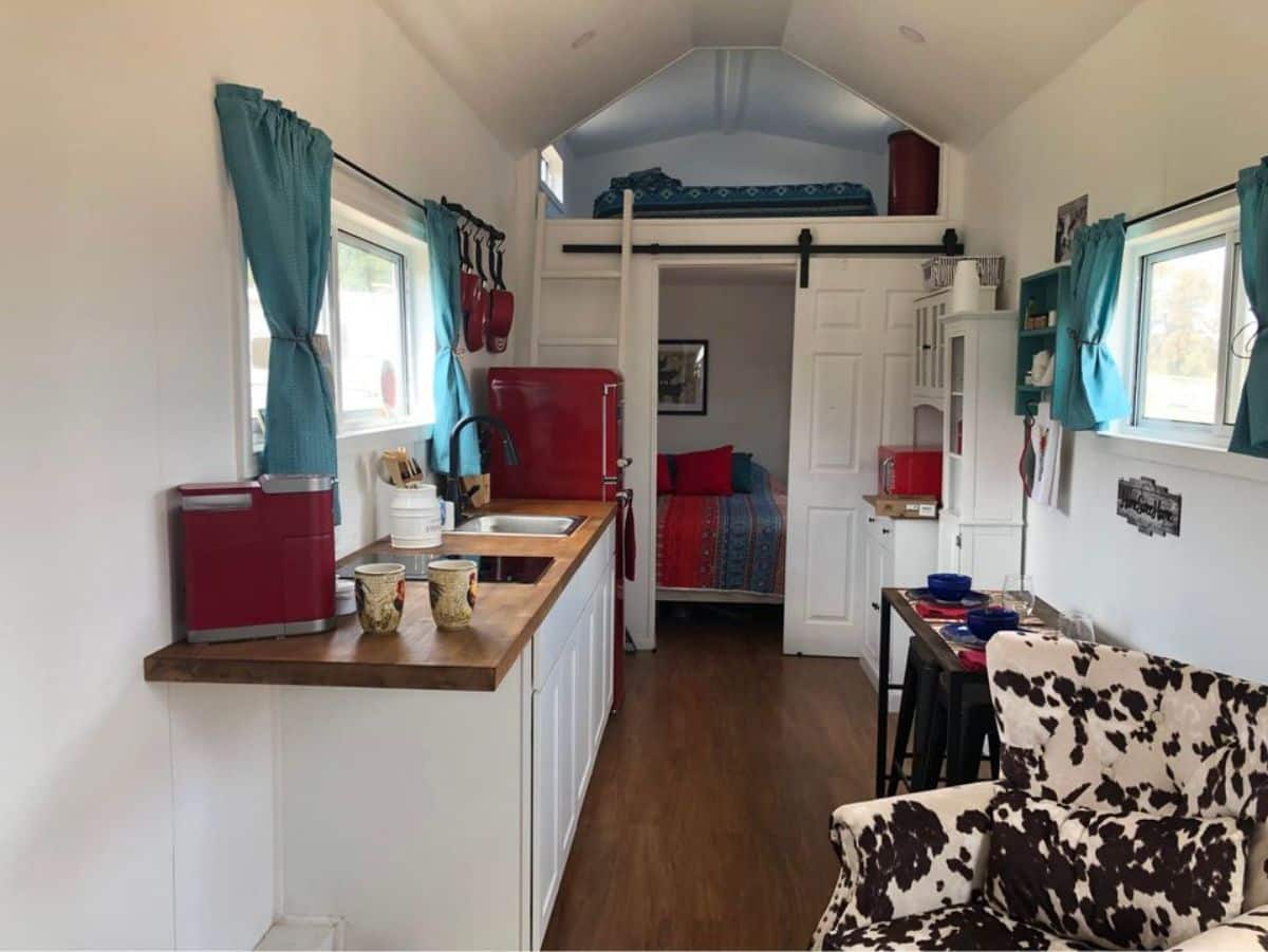 Stunning interior of 28’ Fully Furnished Tiny House from living area view