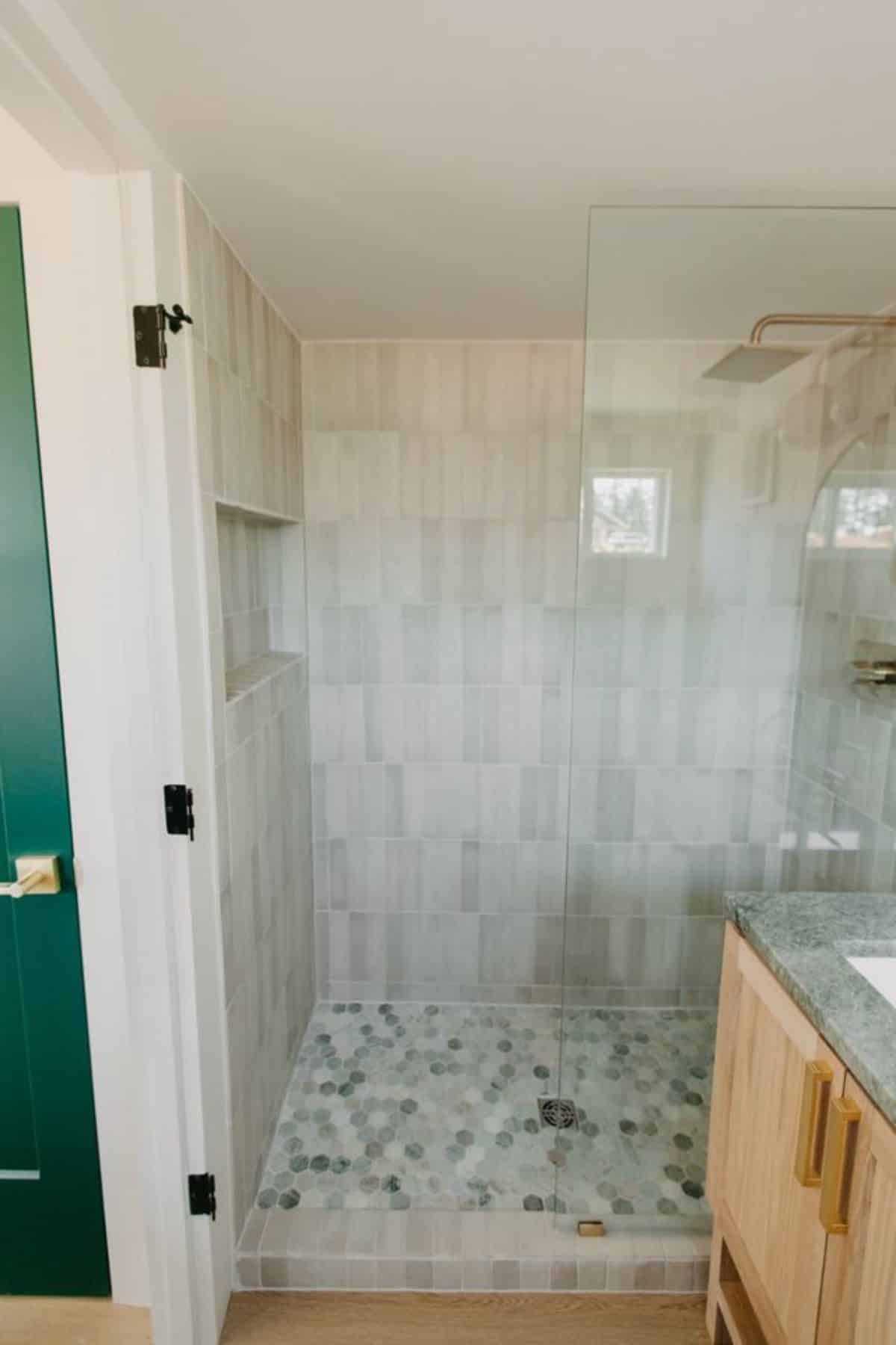 Separate shower area in bathroom of 30' RV Certified Tiny House