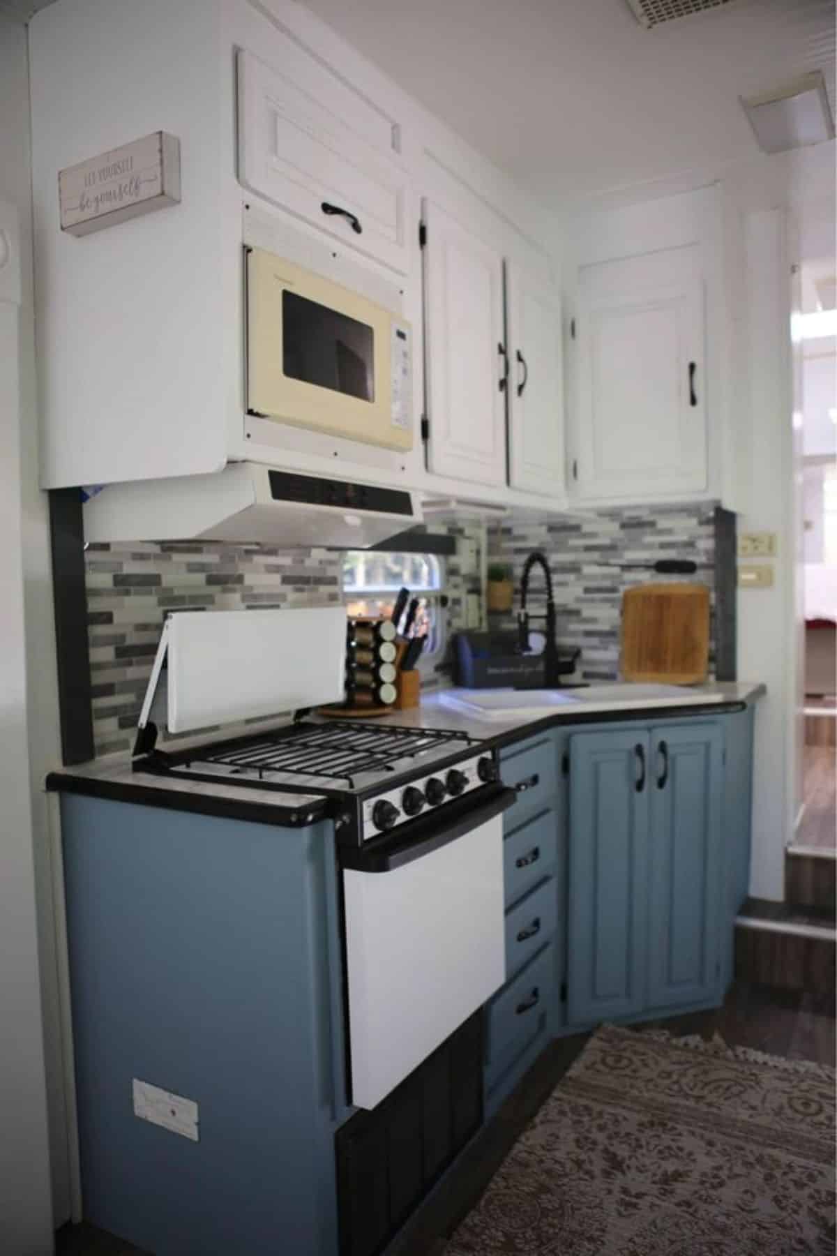 Stylish open kitchen area of 37’ Upgraded Tiny House