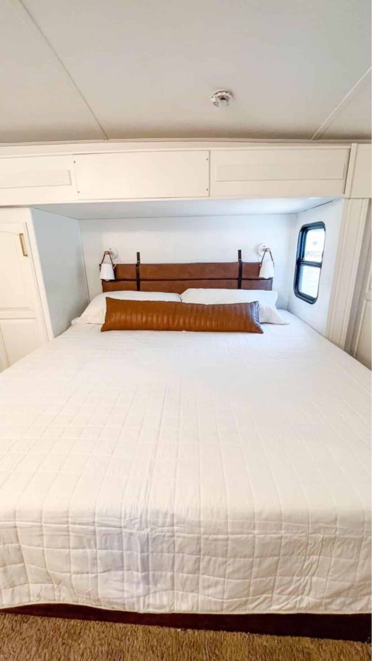 King sized bed in bedroom of 40' Tiny House