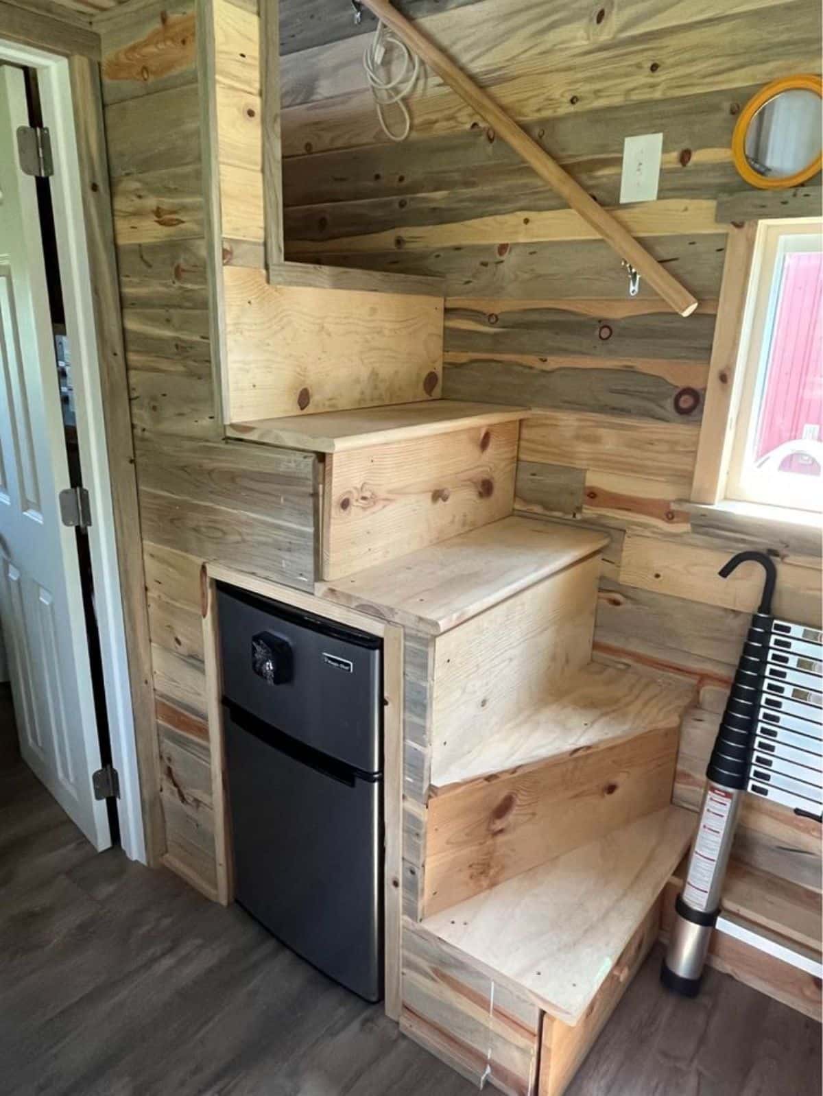 Small refrigerator under the stairs