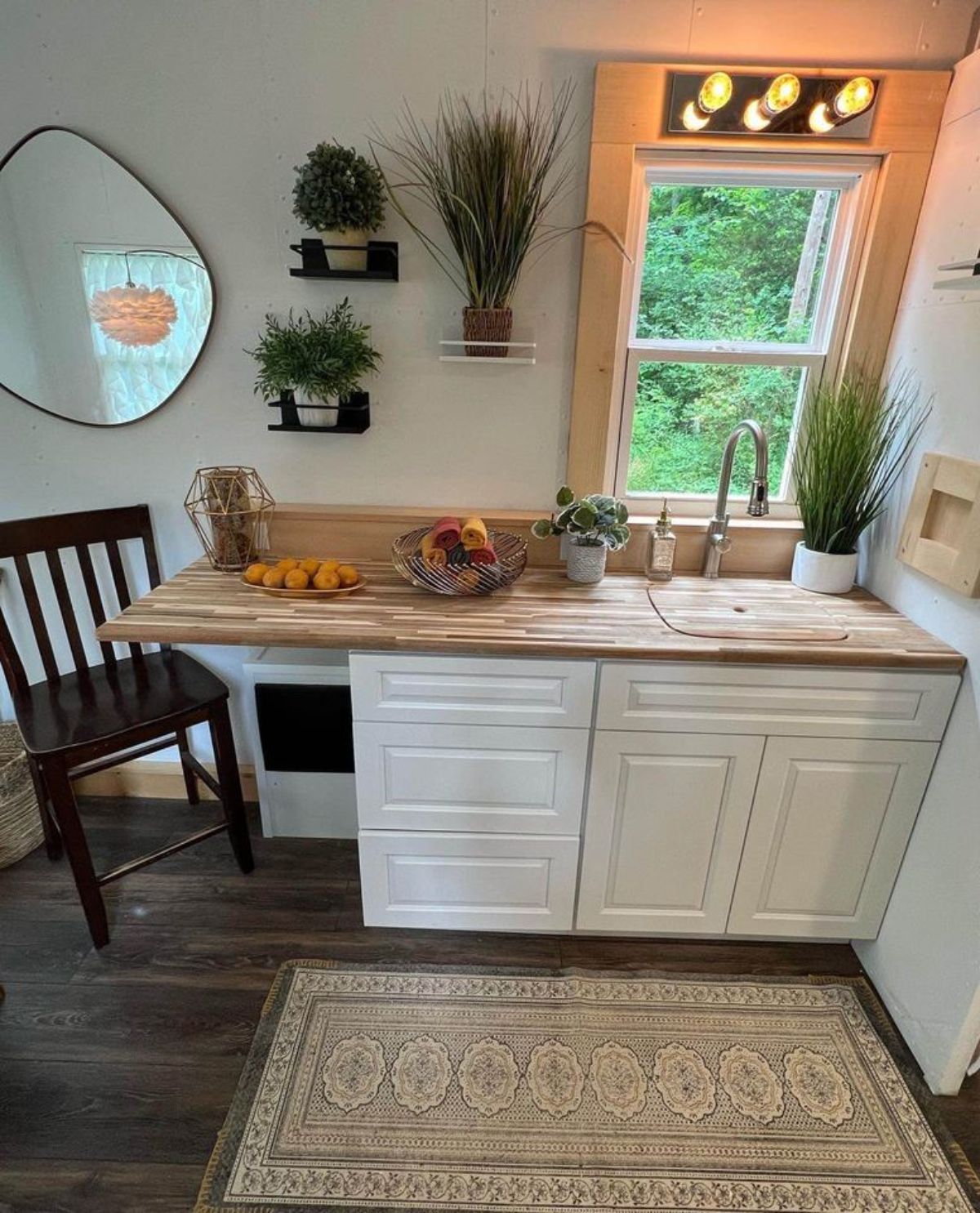 Stunning kitchen area of 16’ Turnkey Ready Tiny House has a lots of storage