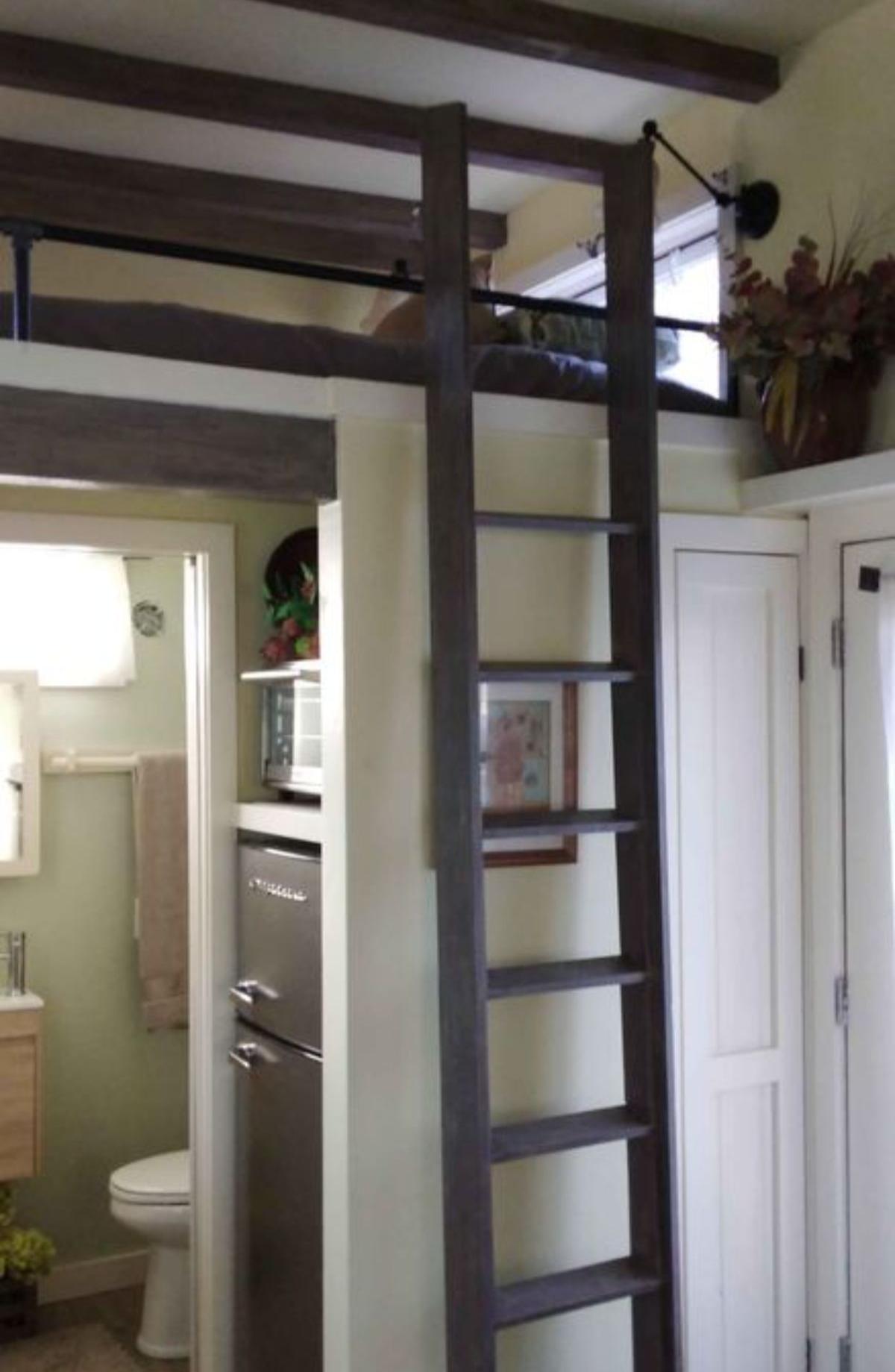 Ladder towards the loft bedroom above the bathroom of 2 Bedroom Tiny House