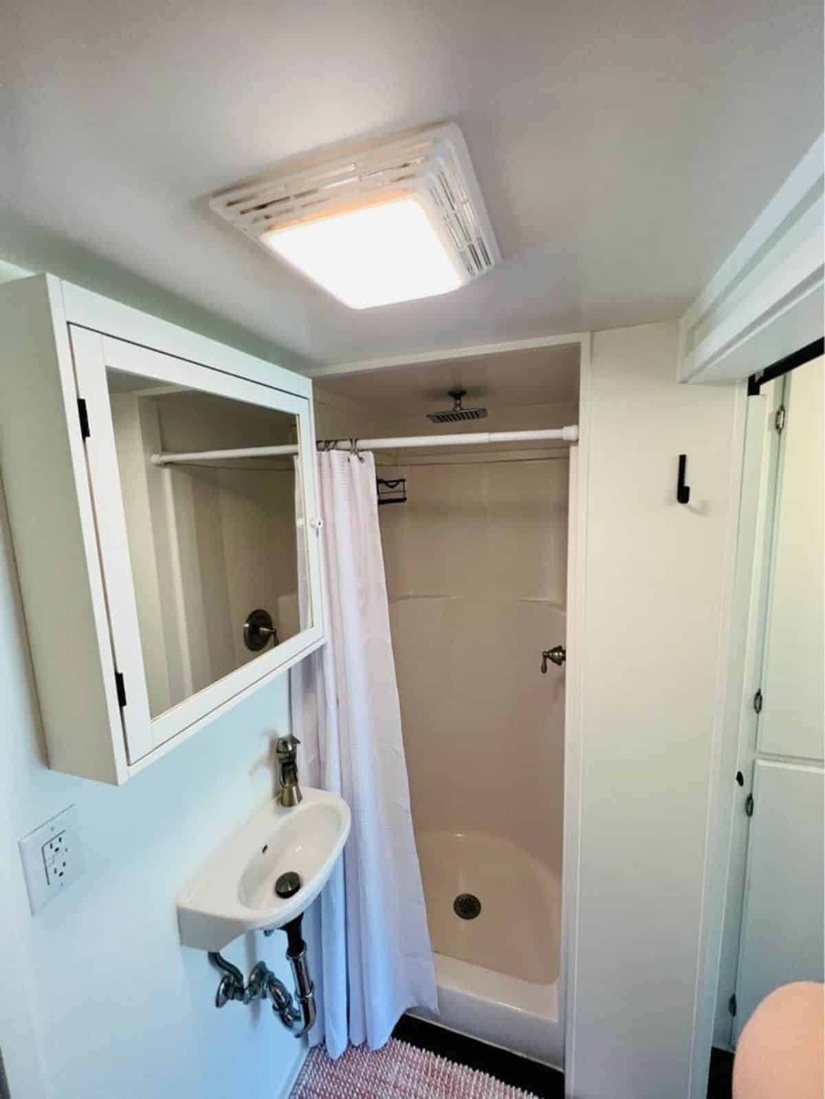 Separate shower area in bathroom of 20’ Furnished Tiny Home