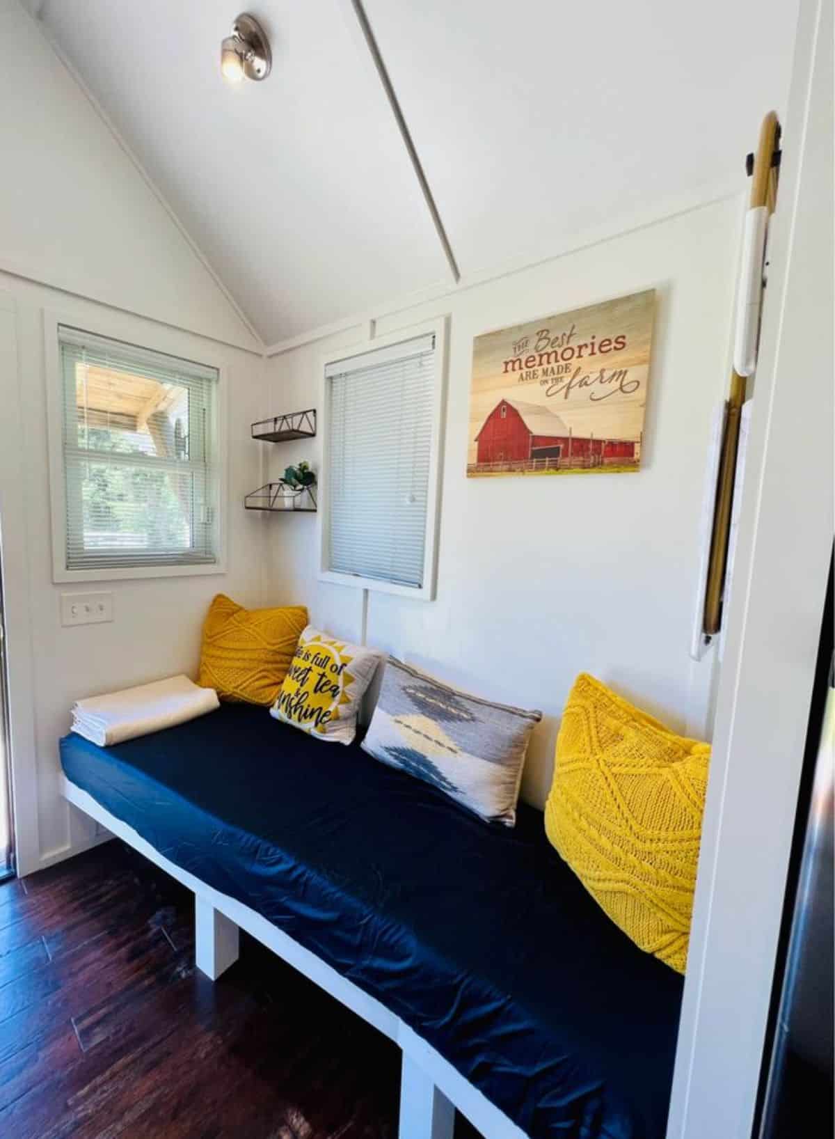 Living area of 20’ Furnished Tiny Home has a couch