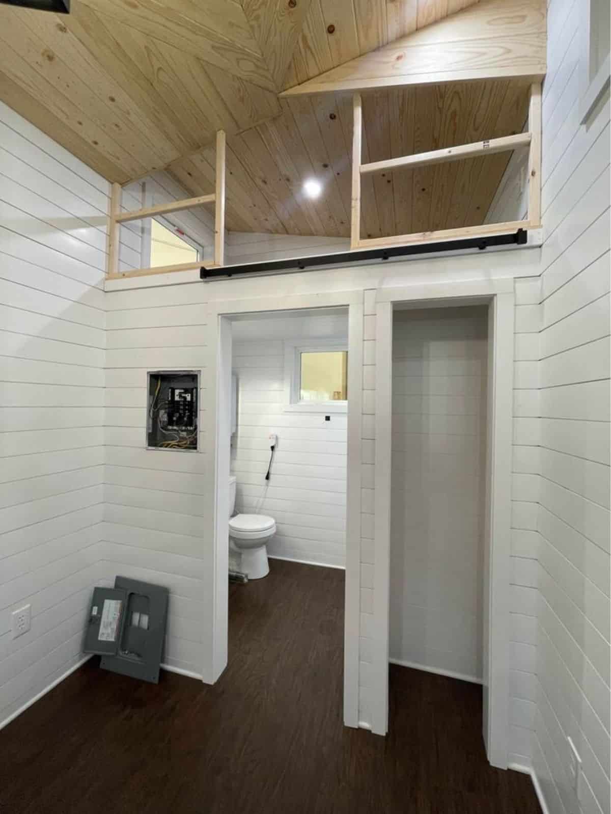 Loft bedroom is above the kitchen and another loft bedroom is above the bathroom