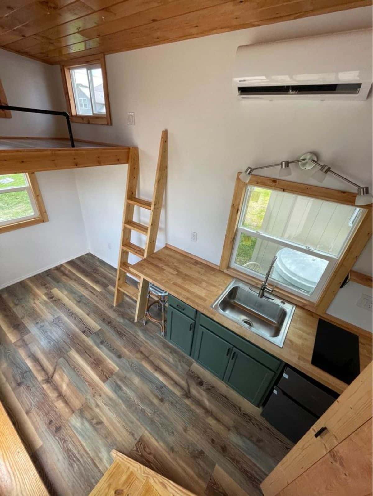 Overall wooden interiors with waterproof laminated flooring of 20' Towable Tiny Home