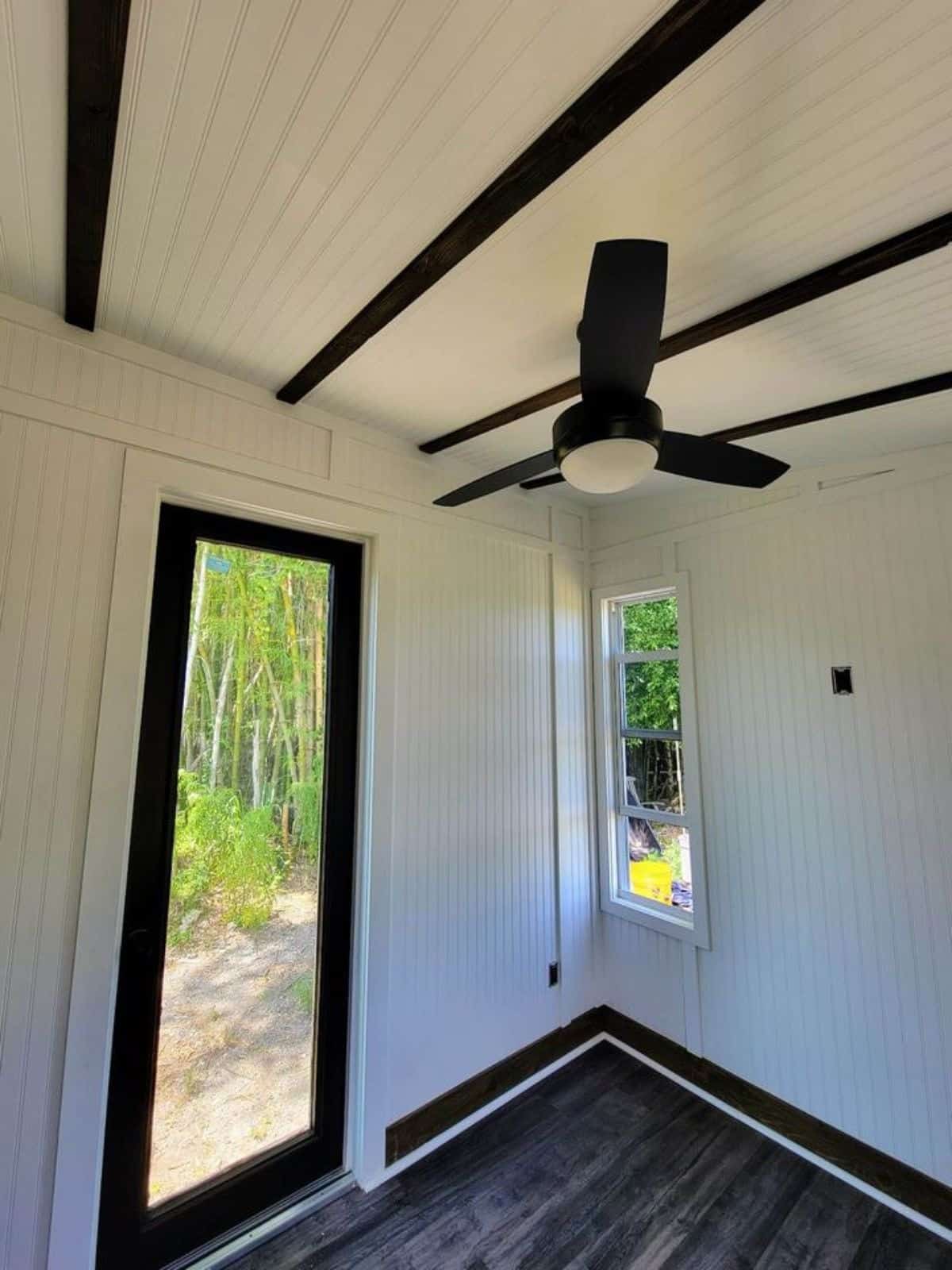 Entrance door of 200 sq ft Charming Tiny House can be the main entrance
