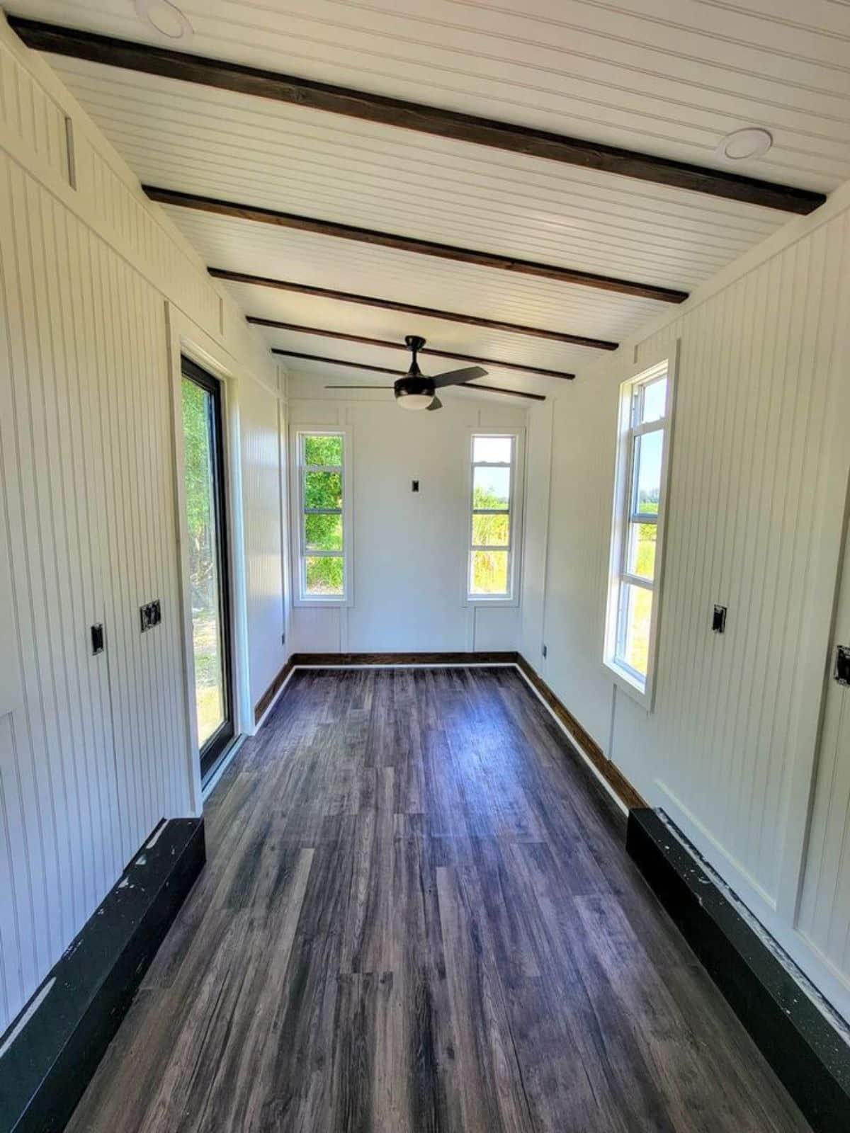 Classic white insulated wooden walls and vinyl flooring all over the house