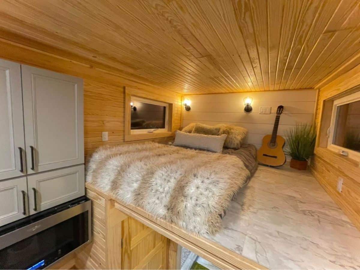 Loft bedroom of 24' Luxury Tiny House can accommodate a queen mattress and still has an ample space