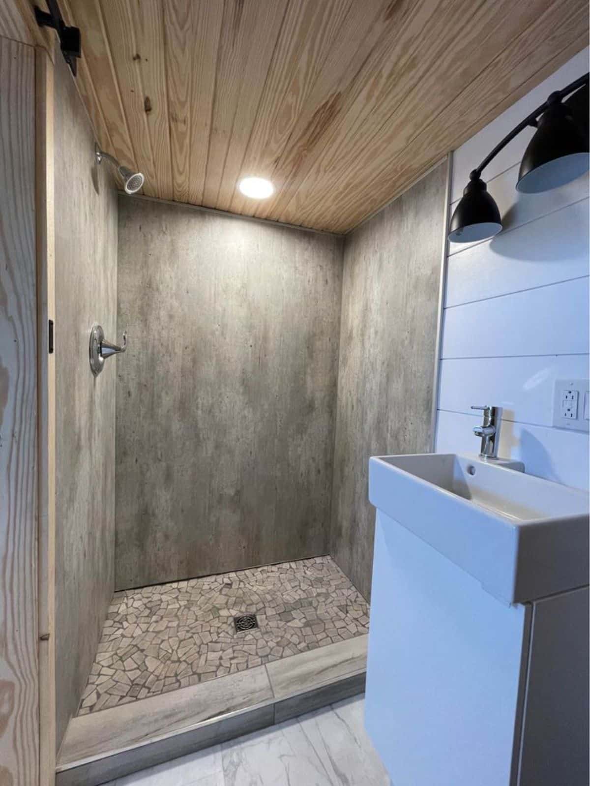 Separate shower area in bathroom of 24' Luxury Tiny House