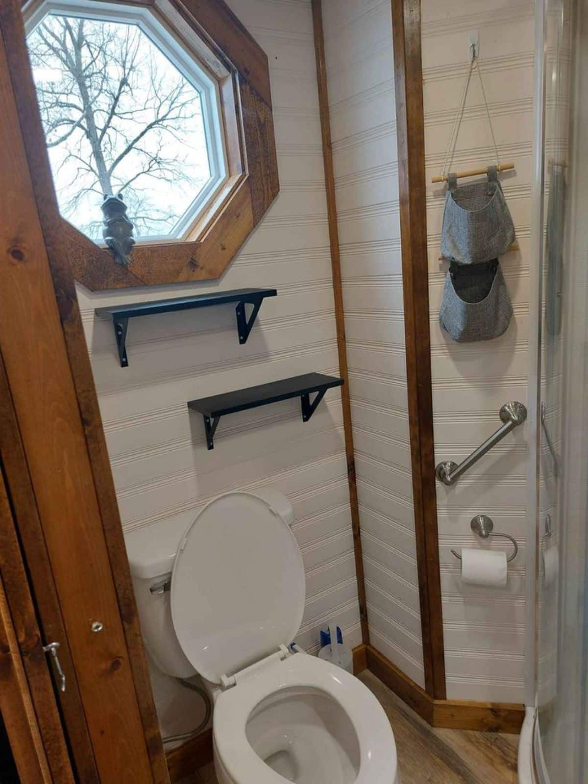 Standard toilet is installed in bathroom