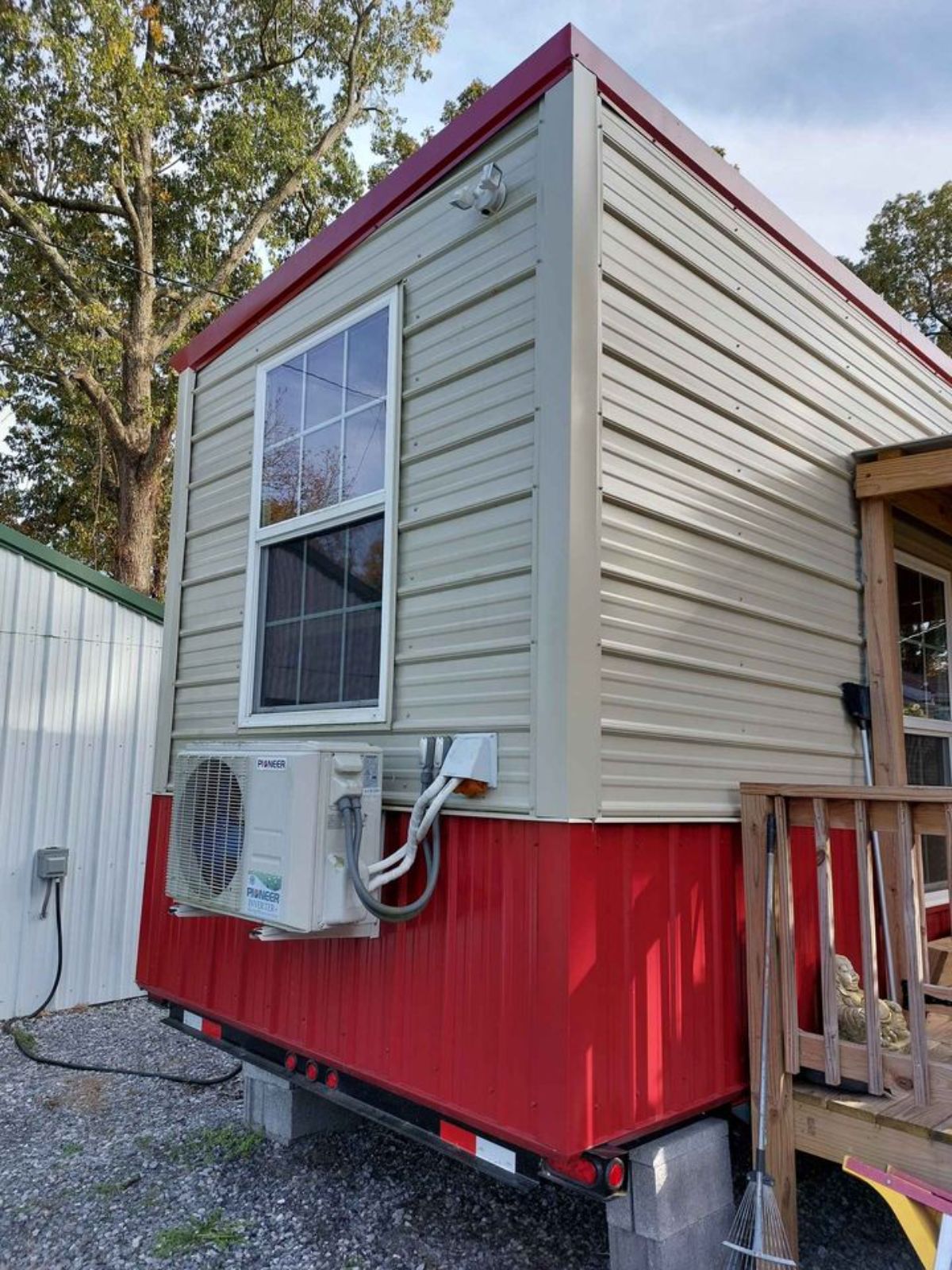 Stunning red and white combination exterior of 24' NOAH Certified Tiny House with Porch
