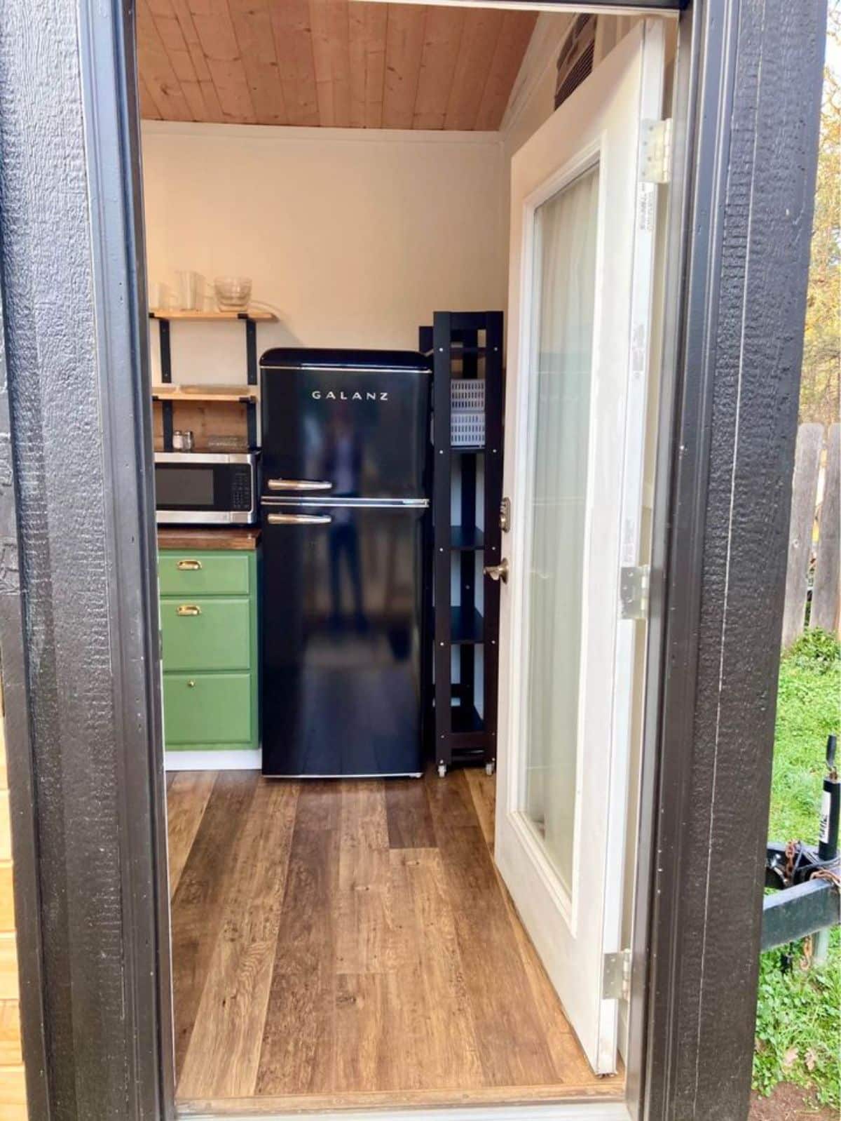 Kitchen area right in front of main entrance door of 25' Beautiful Tiny Home