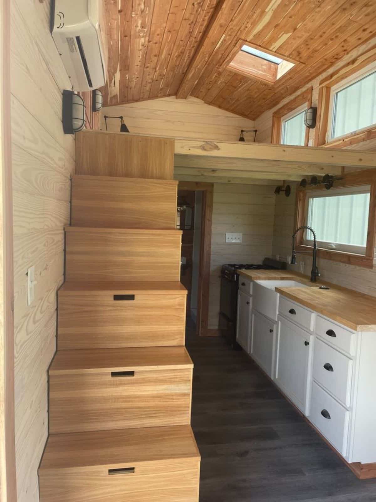 Stairs leading to the main loft bedroom of 326 sf Spacious Tiny House