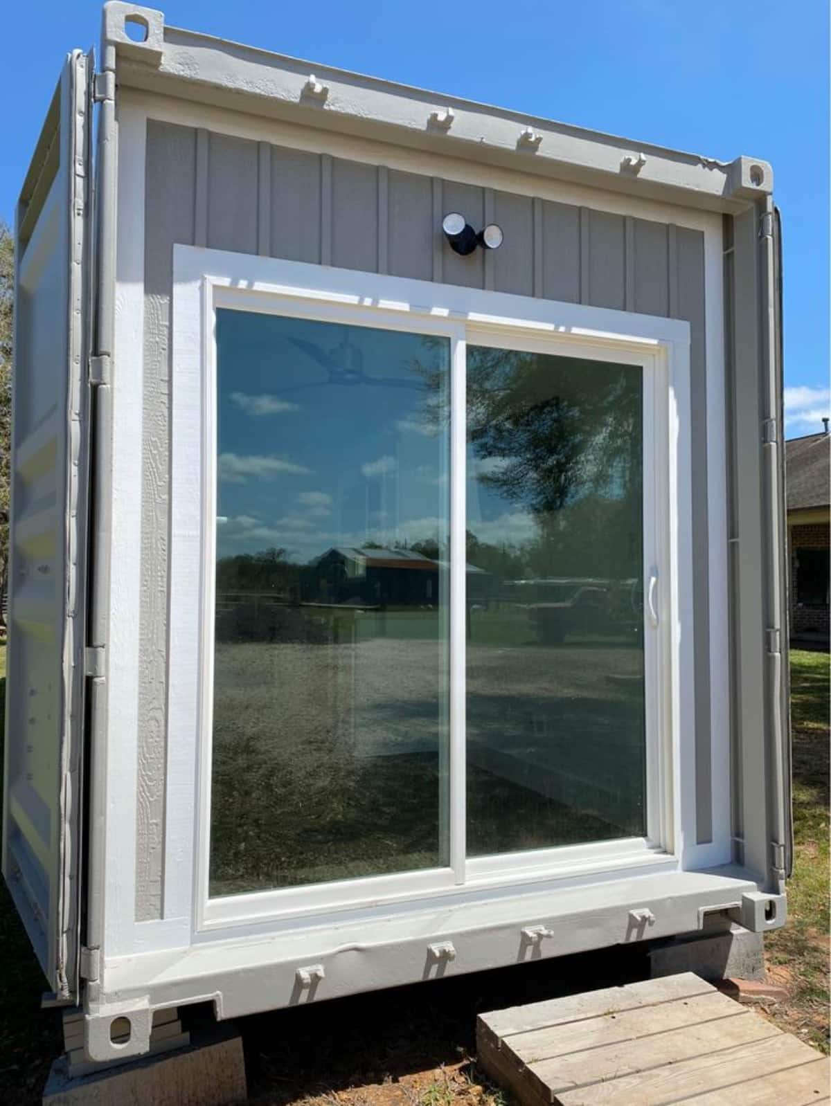 Main glass entrance view of 40’ Shipping Container Tiny Home