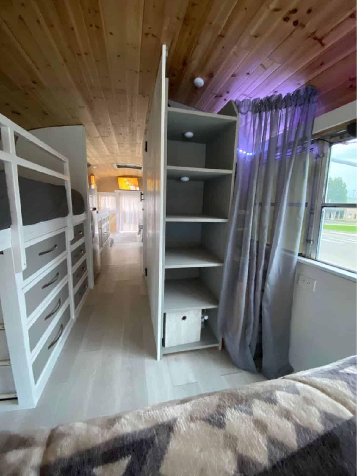 Storage cabinets in front of sleeping area