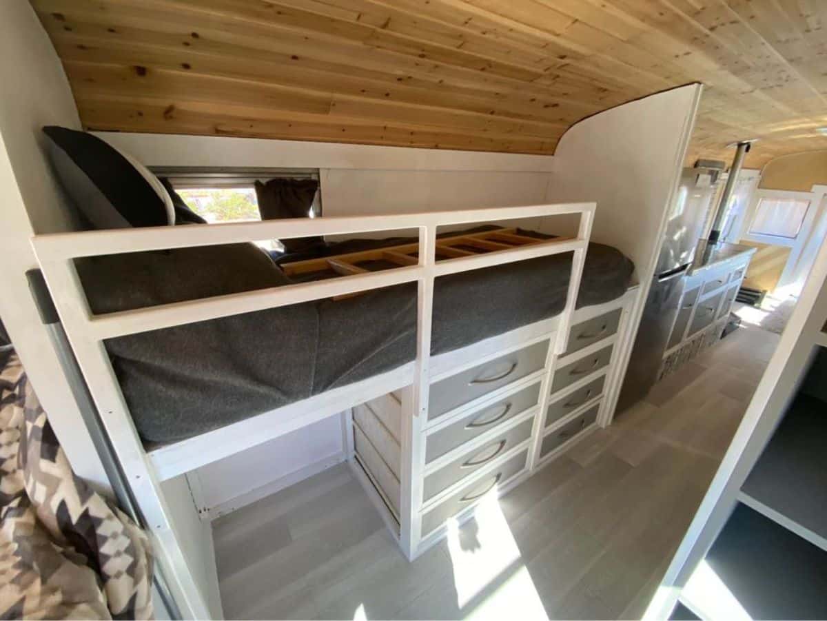 Bunk bed with custom ladder, and a generous amount of storage areas