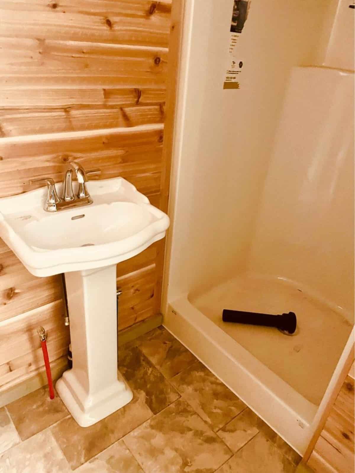 Sink and shower area of Gorgeous Red Cedar Tiny Home
