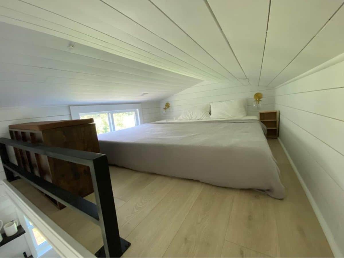 Loft bedroom is very spacious and has a king mattress, wooden unit for all the necessary essentials still ample space