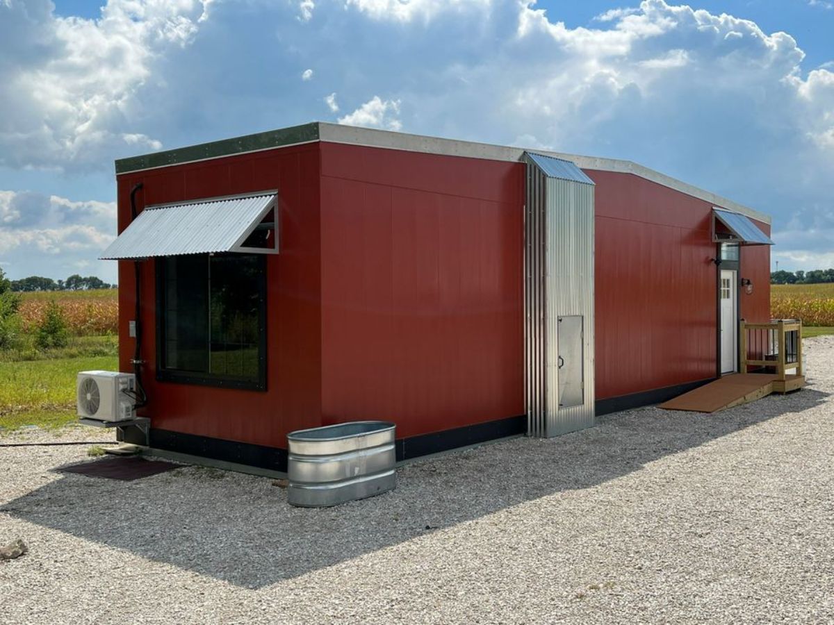 Red exterior of Spacious Eco Friendly & 91% Recyclable Tiny House
