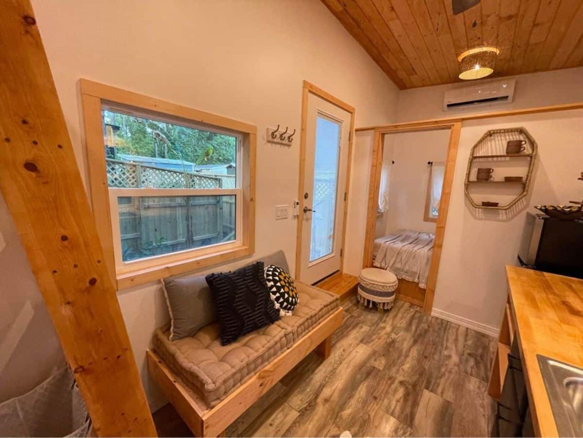 Living area of Towable tiny house has a small couch