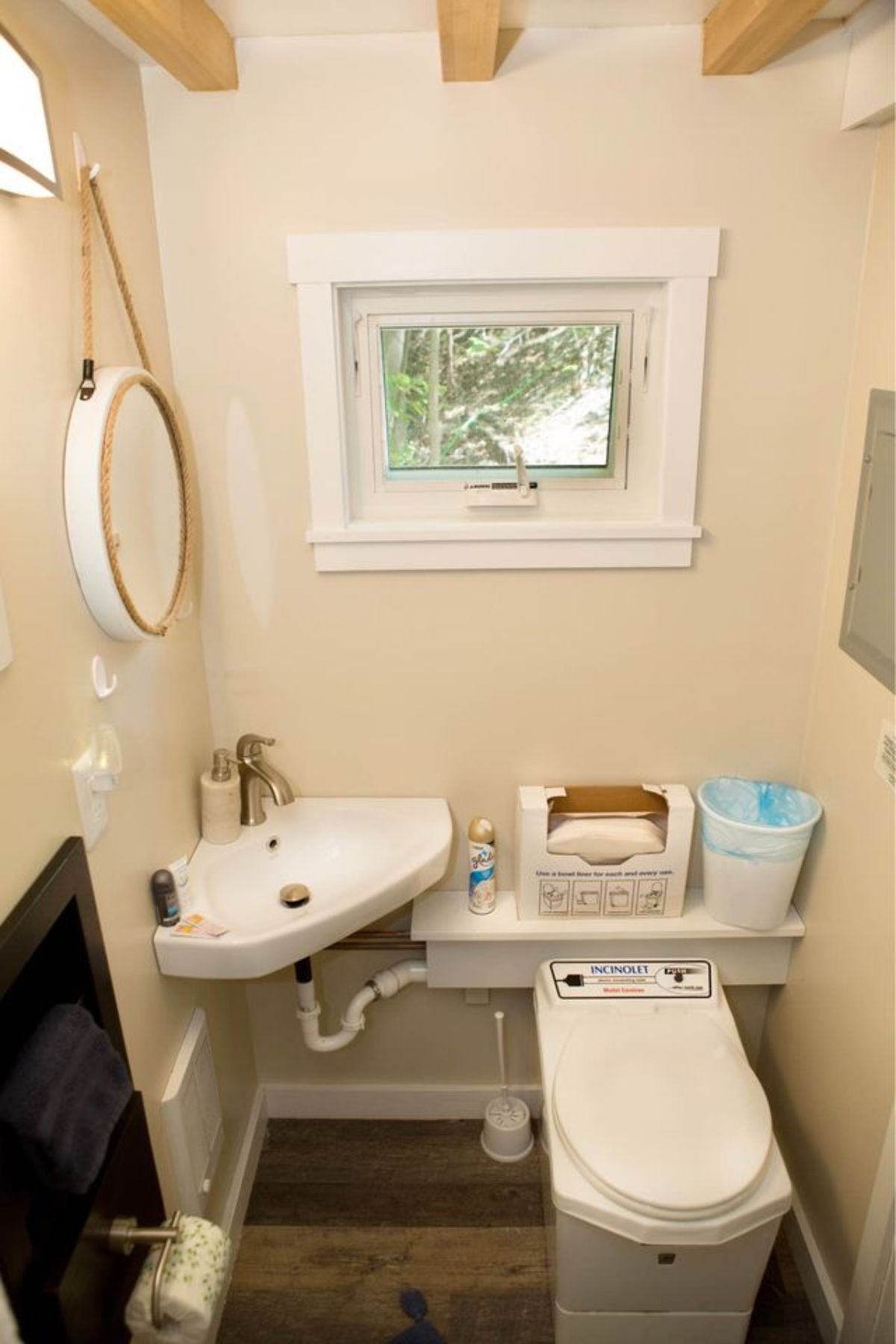 Sink with mirror and standard toilet is installed in the bathroom 