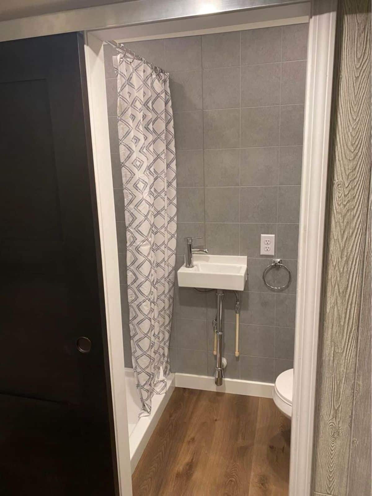 Standard toilet and sink in bathroom