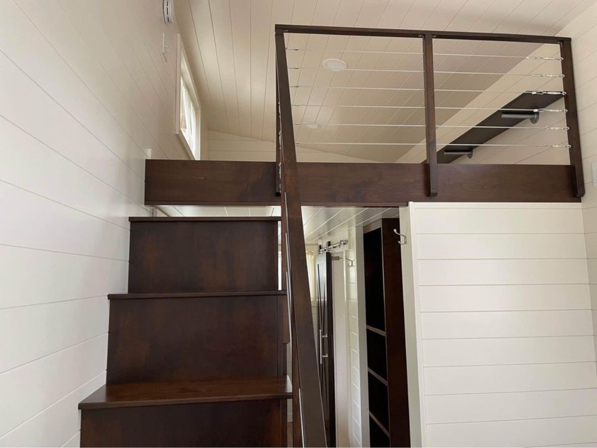 King size loft is accessible through the stairs and has an ample space