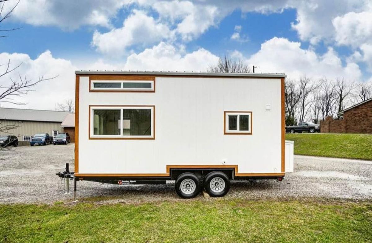 Stunning white with brown bodder exterior of 20’ Modern Tiny Home on Wheels