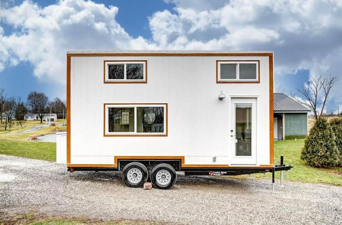 Huge glass windows and sliding glass entrance door of 20’ Modern Tiny Home on Wheels
