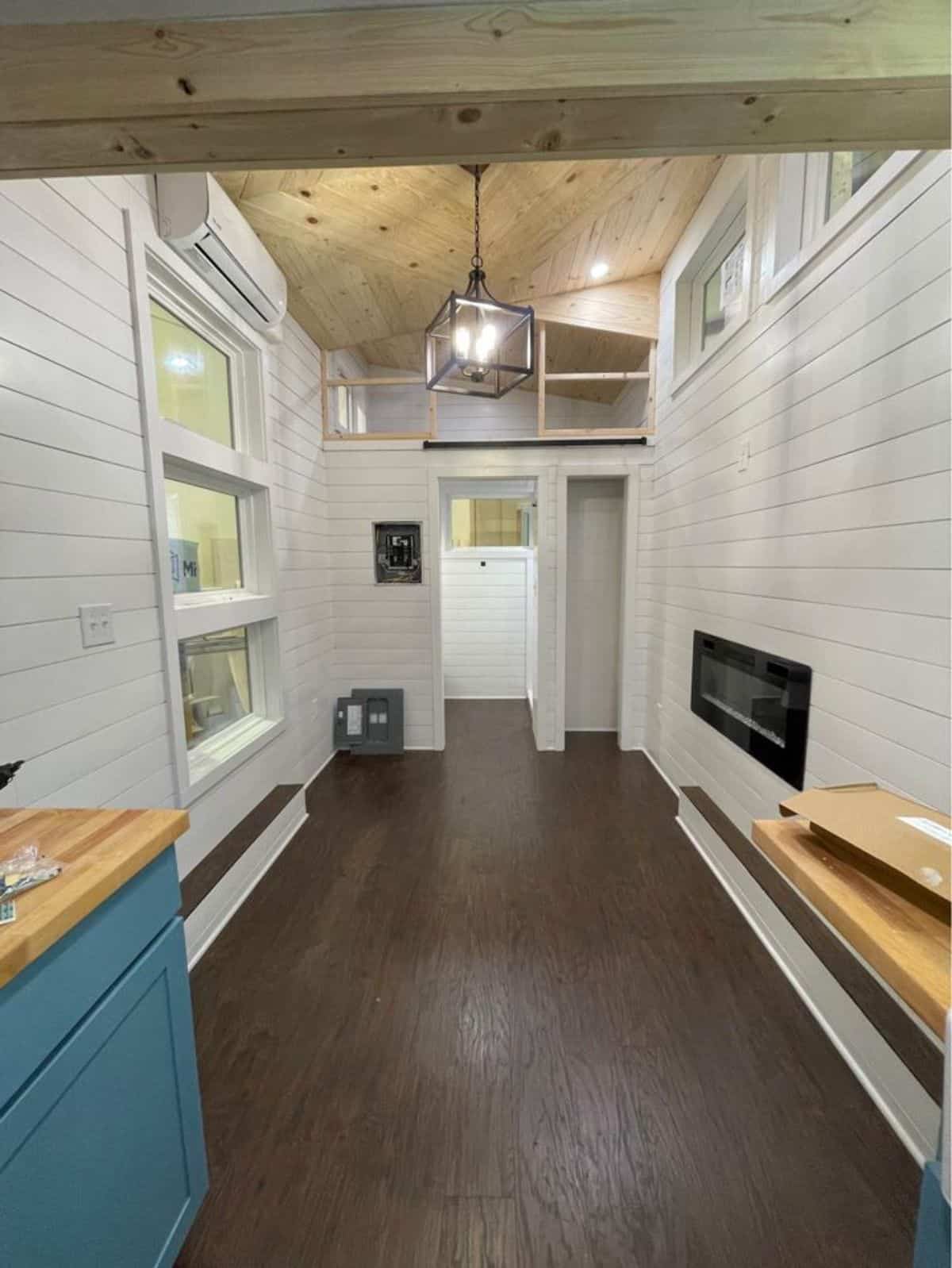 Insulated wooden flooring all over the 20' Noah Certified Tiny House on Wheels