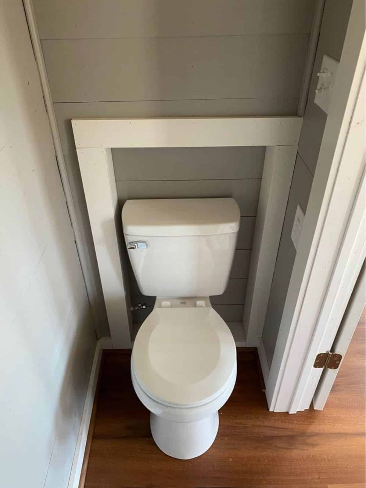 Standard toilet in bathroom