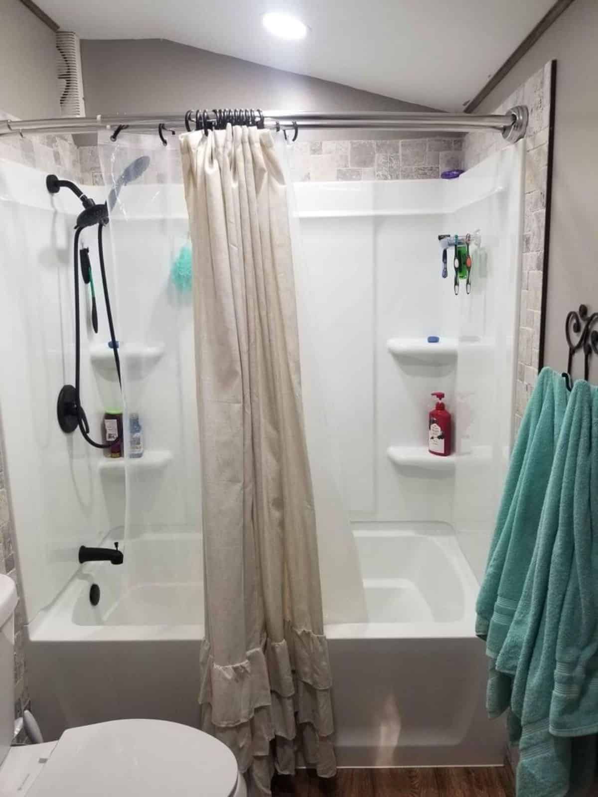 Huge full length bathtub in installed in bathroom of 24' Gorgeous Tiny Home