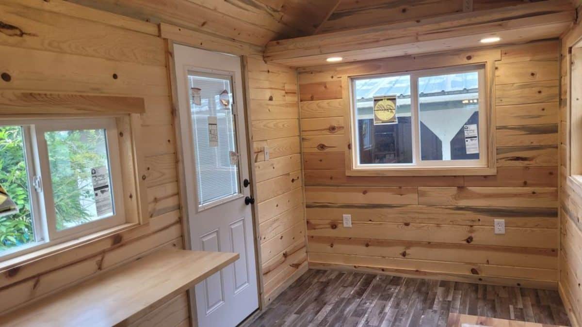 Living area of 28’ tiny house on wheels is small but can accommodate a couch