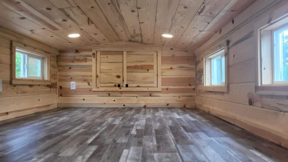 Loft 1 of 28’ tiny house on wheels is big and is accessible with the ladder has an ample space