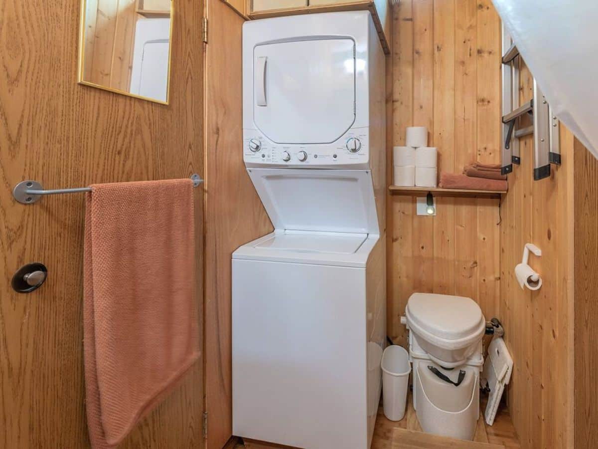 Washer dryer combo and standard toilet is installed in bathroom